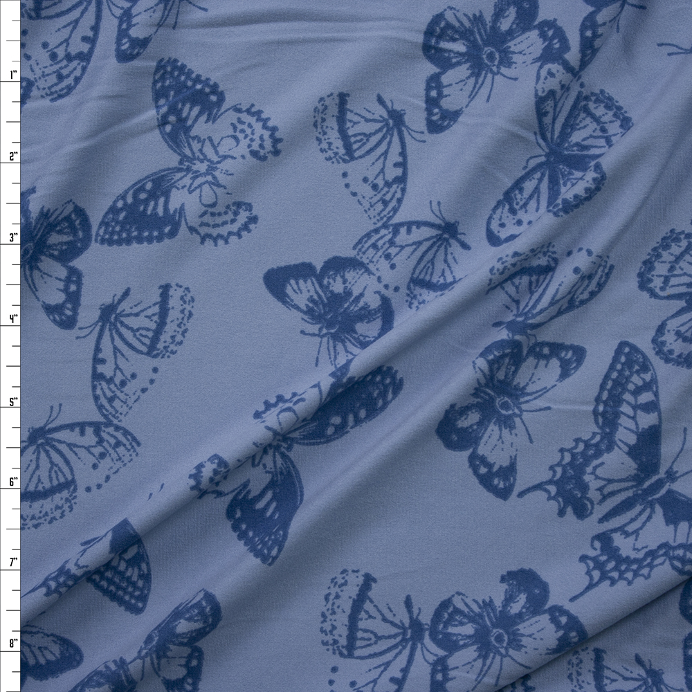 Royal Butterflies on Sky Blue Double Brushed Poly/Spandex Knit Fabric By The Yard