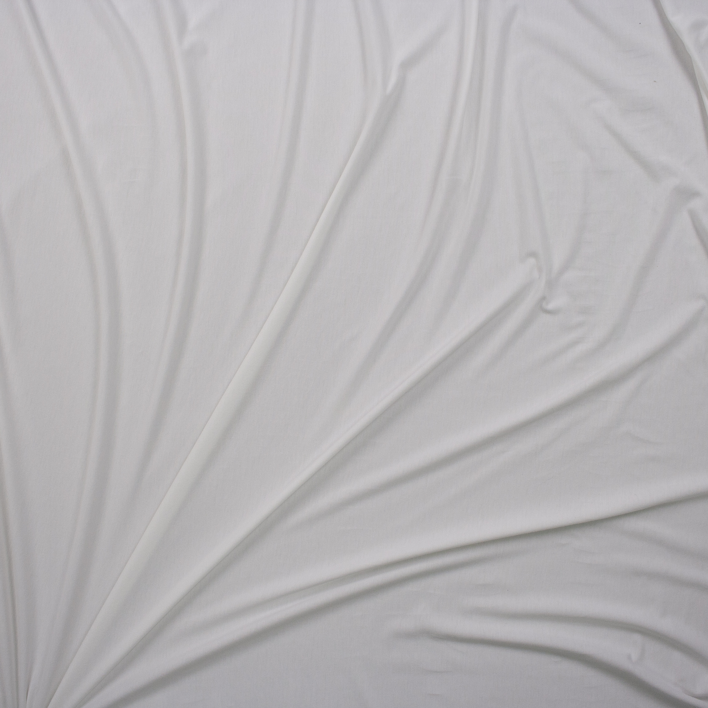 Warm White Lightweight Poly/Modal Jersey Knit Fabric By The Yard - Wide shot