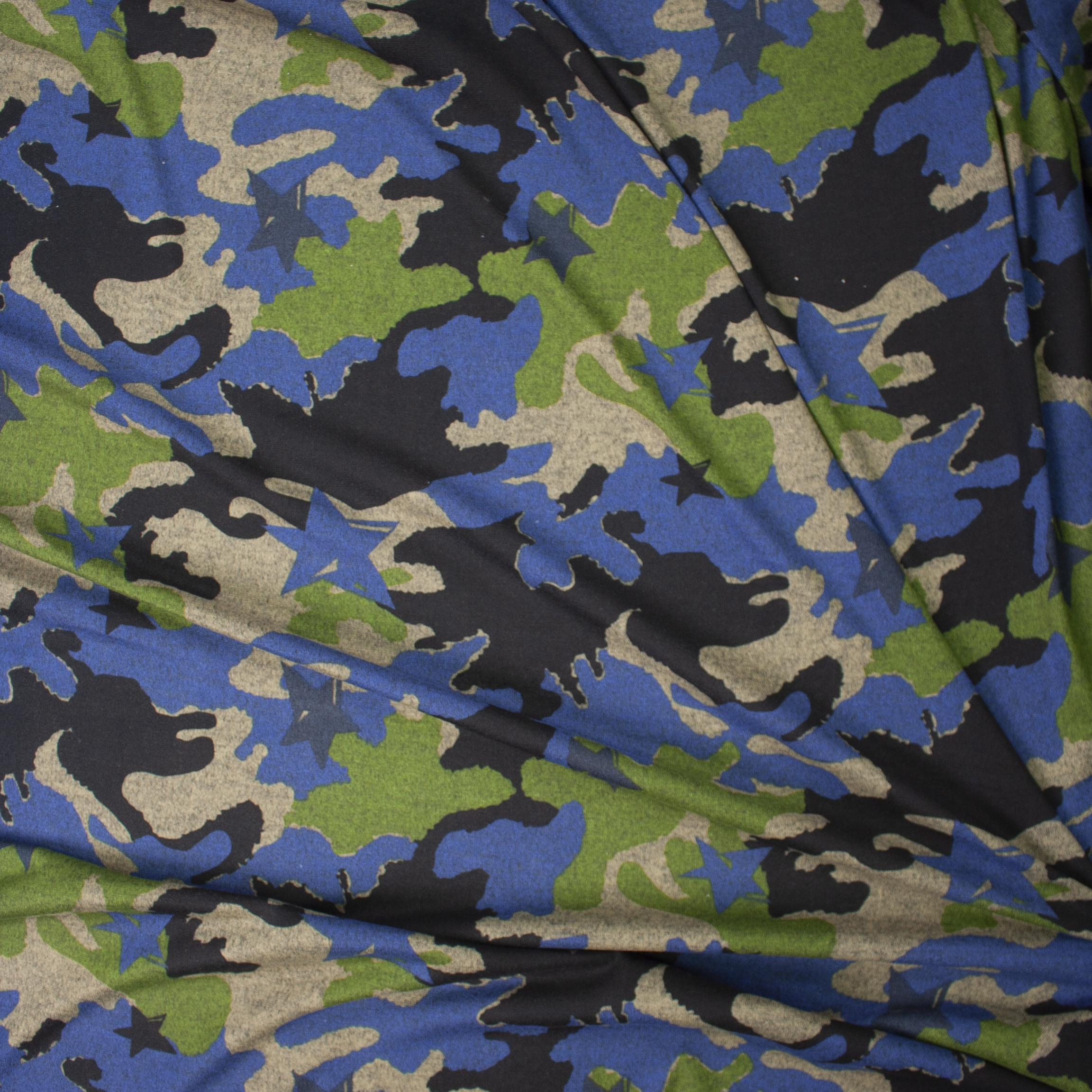 Green, Tan, Black, and Blue Stars and Camouflage Designer Hacci Knit Fabric By The Yard - Wide shot