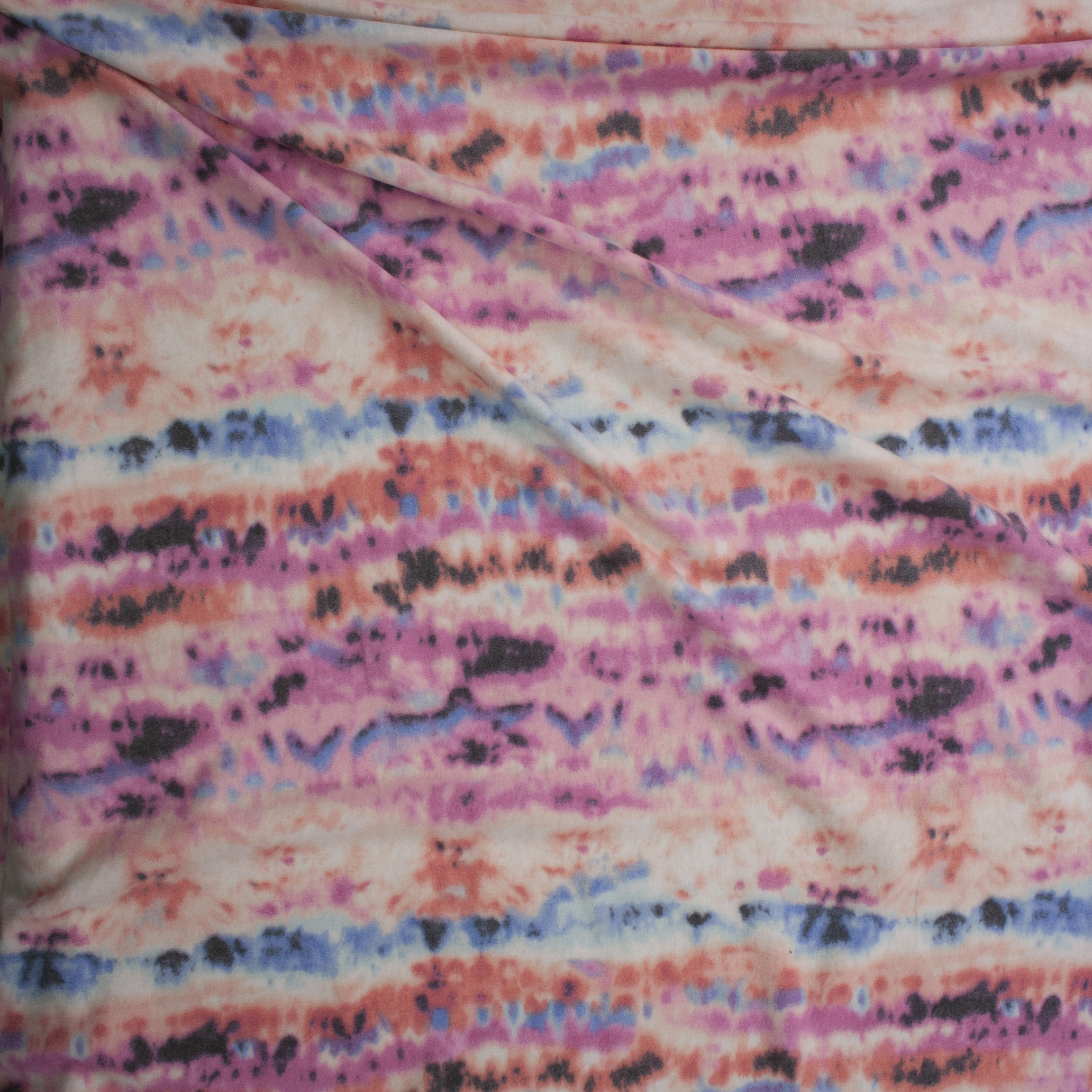 Pink, Coral, Blue, Charcoal, and White Horizontal Banded Tie Dye Brushed Hacci Knit Fabric By The Yard - Wide shot
