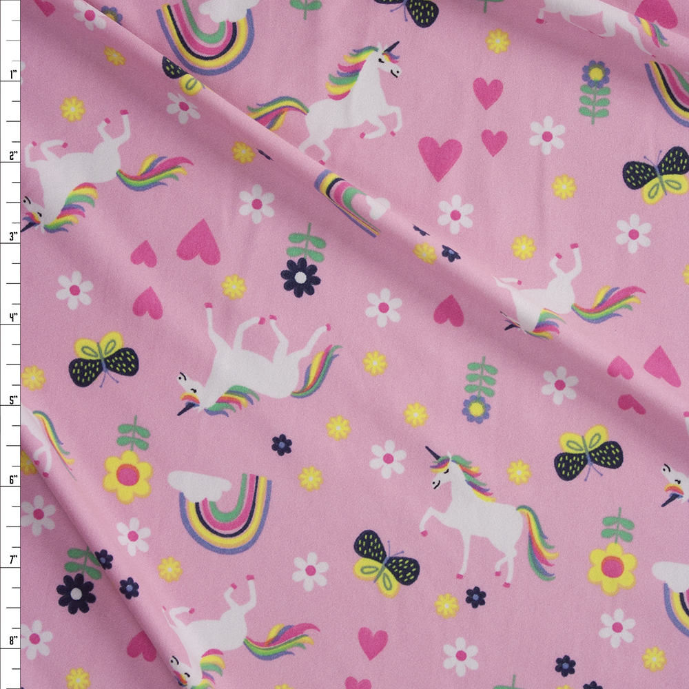 Unicorns, Rainbows, and Butterflies on Pink Double Brushed Poly/Spandex Fabric By The Yard