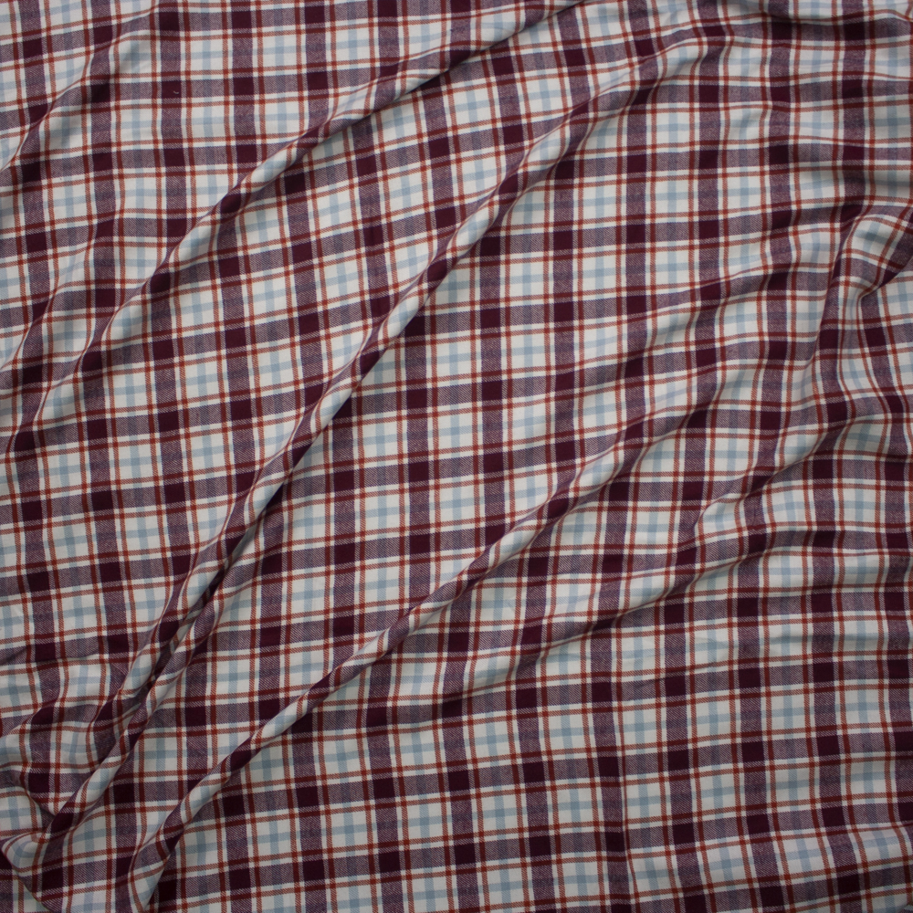 Burgundy, Rust, White, and Light Blue Plaid Poly/Rayon Flannel Fabric By The Yard - Wide shot