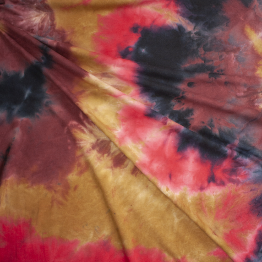 Red, Tan, and Black Tie Dye Midweight Cotton French Terry Fabric By The Yard - Wide shot