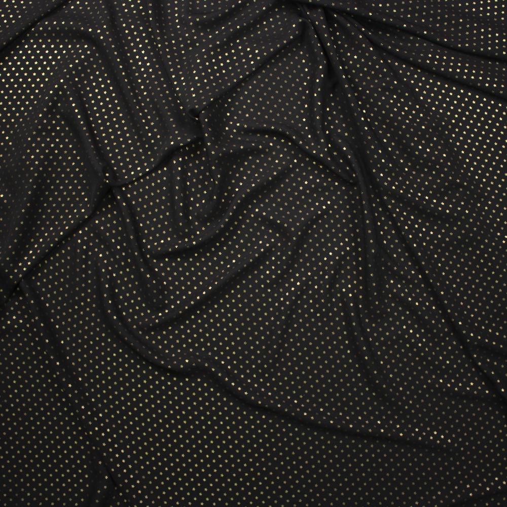 Metallic Gold Stars on Black Georgette Fabric By The Yard - Wide shot