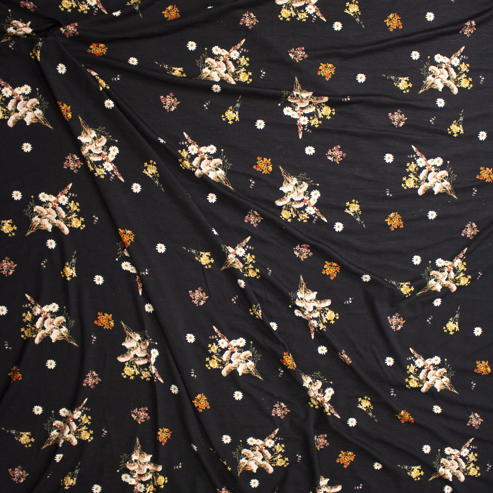 Orange and Mustard Wildflowers on Black Stretch Rayon Jersey Fabric By The Yard - Wide shot