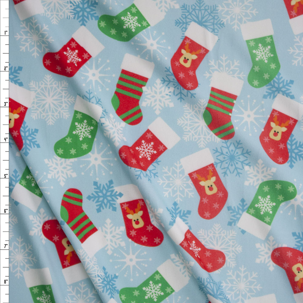 Christmas Stockings and Snowflakes on Light Blue Stretch Double Brushed Poly/Spandex Knit Fabric By The Yard