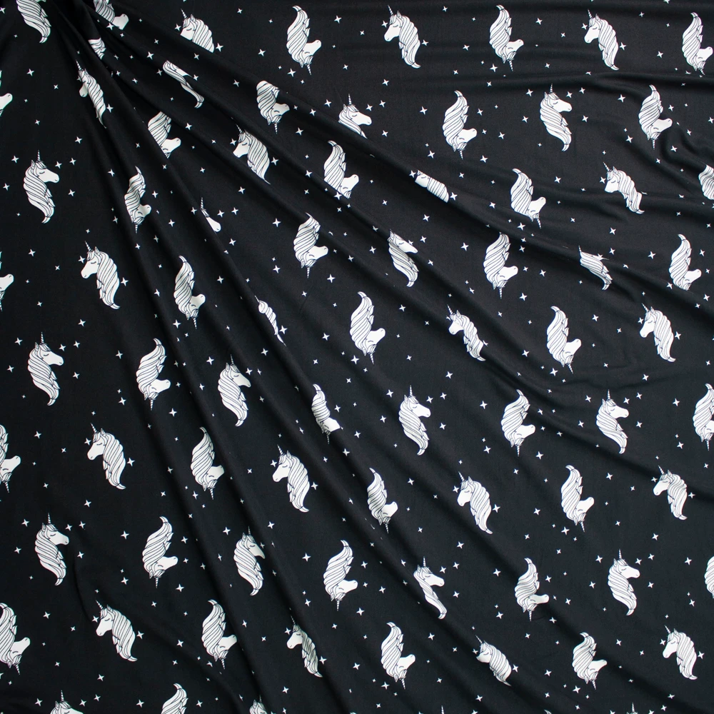 White Stars and Unicorns on Black Double Brushed Poly/Spandex Knit Fabric By The Yard - Wide shot