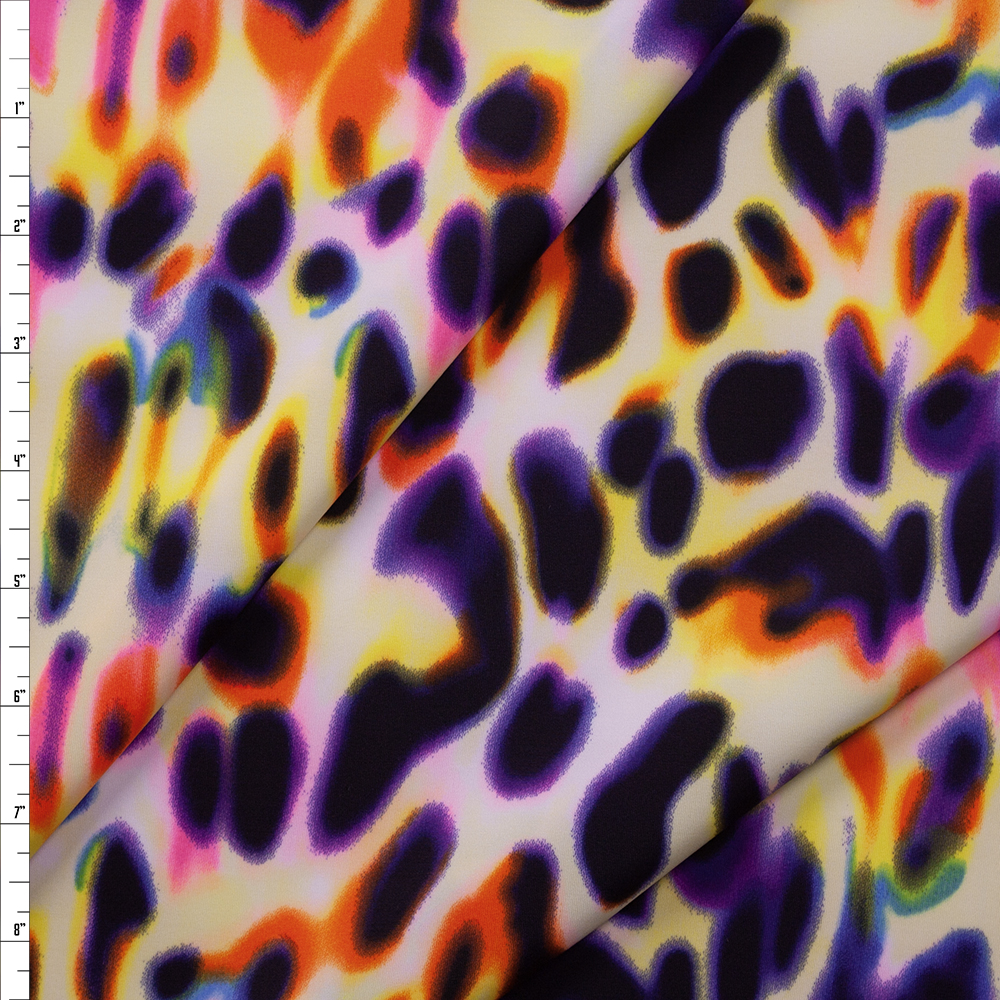 Black, Orange, Yellow, and Blue Glowing Spots Nylon/Spandex Fabric By The Yard