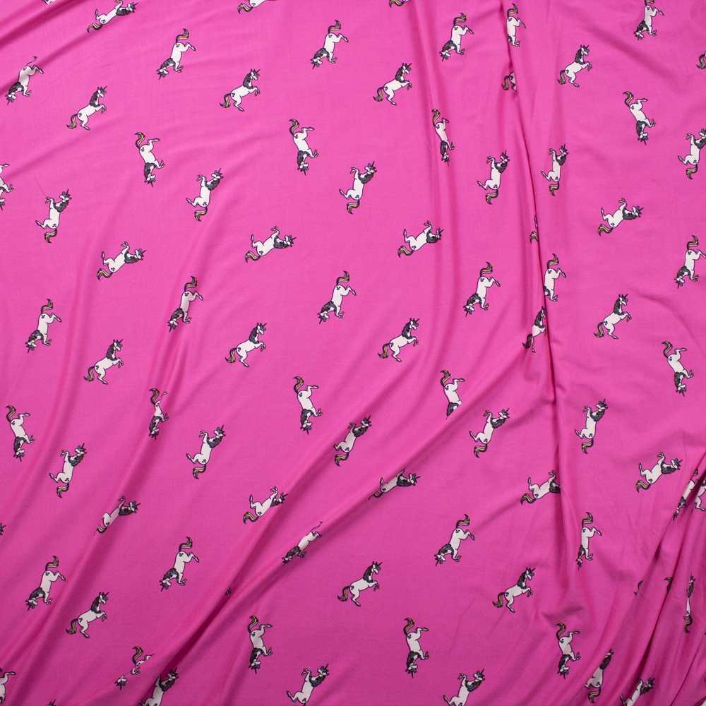 White Unicorns on Neon Pink Double Brushed Poly Fabric By The Yard - Wide shot