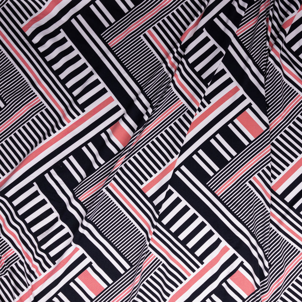 Black, White, and Coral Crisscross Geo Double Brushed Poly/Spandex Knit Fabric By The Yard - Wide shot