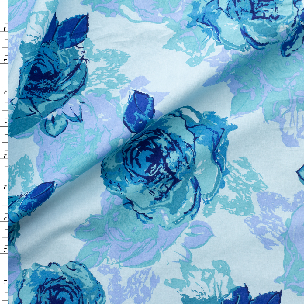 Blue And Turquoise Floral On Light Blue Stretch Cotton Poplin Fabric By The Yard
