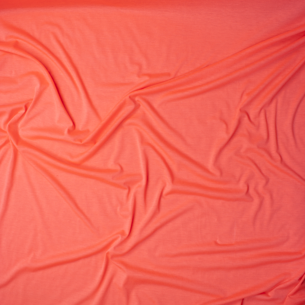 Neon Coral Lightweight Poly/Rayon Jersey Knit Fabric By The Yard - Wide shot