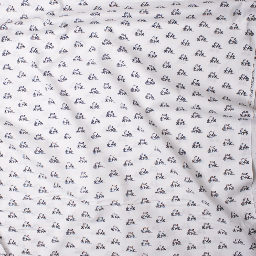 Black Bicycles on White ‘London Calling’ Cotton Lawn by Robert Kaufman Fabric By The Yard - Wide shot