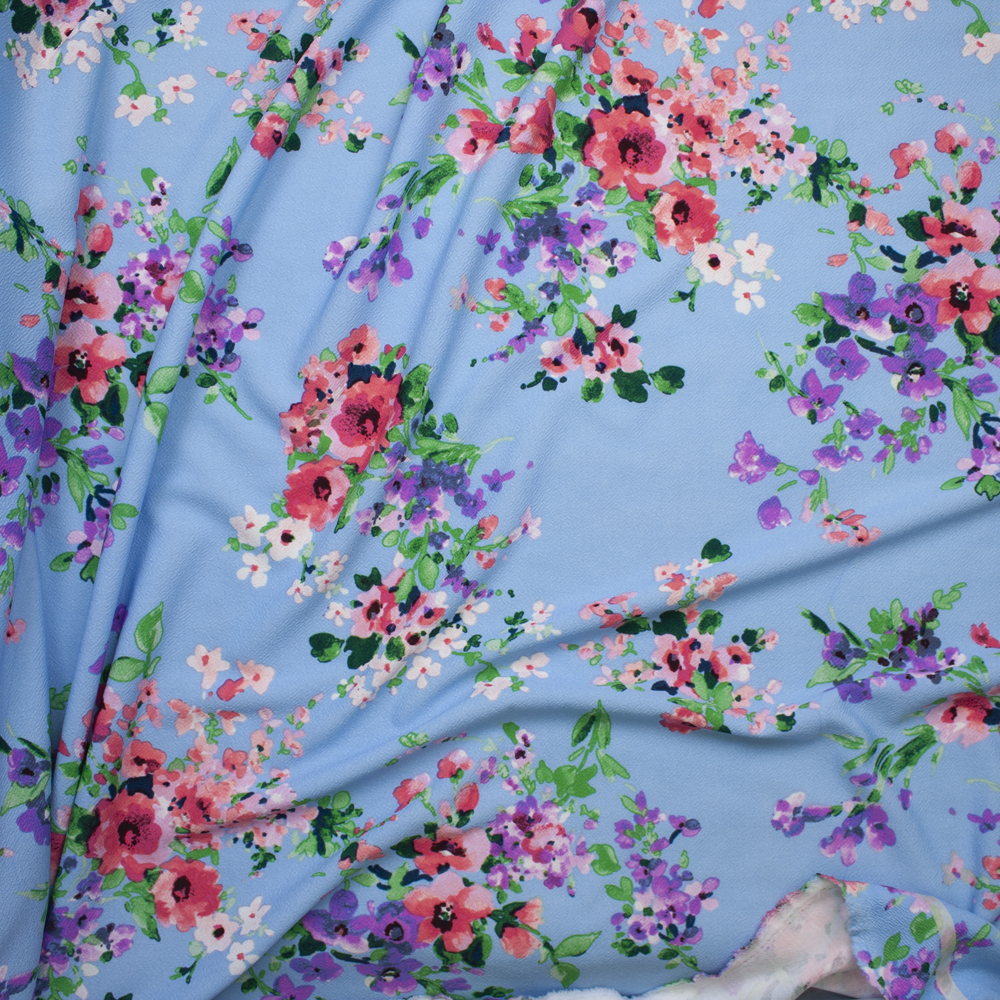 Pink, Purple, and White Watercolor Floral on Sky Blue Liverpool Knit Print Fabric By The Yard - Wide shot