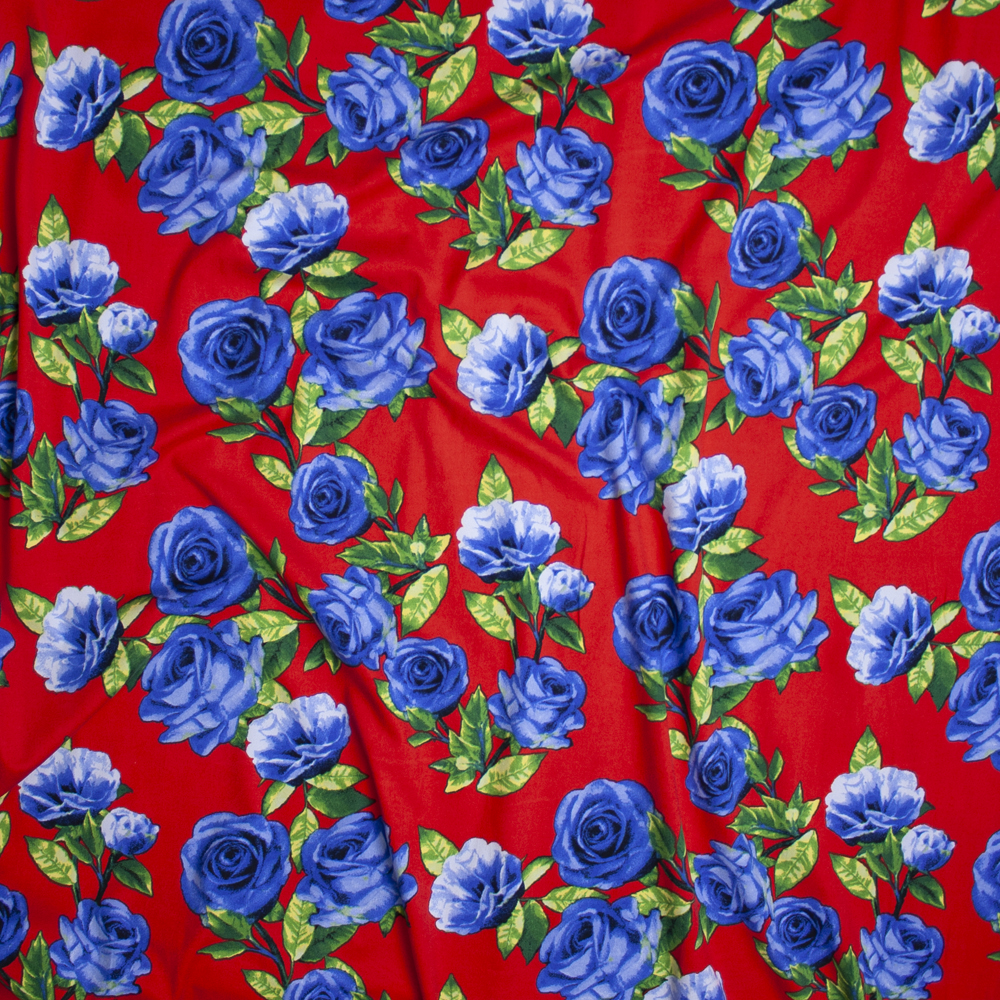 Blue Roses with Green Leaves on Bright Red Double Brushed Poly Spandex Fabric By The Yard - Wide shot
