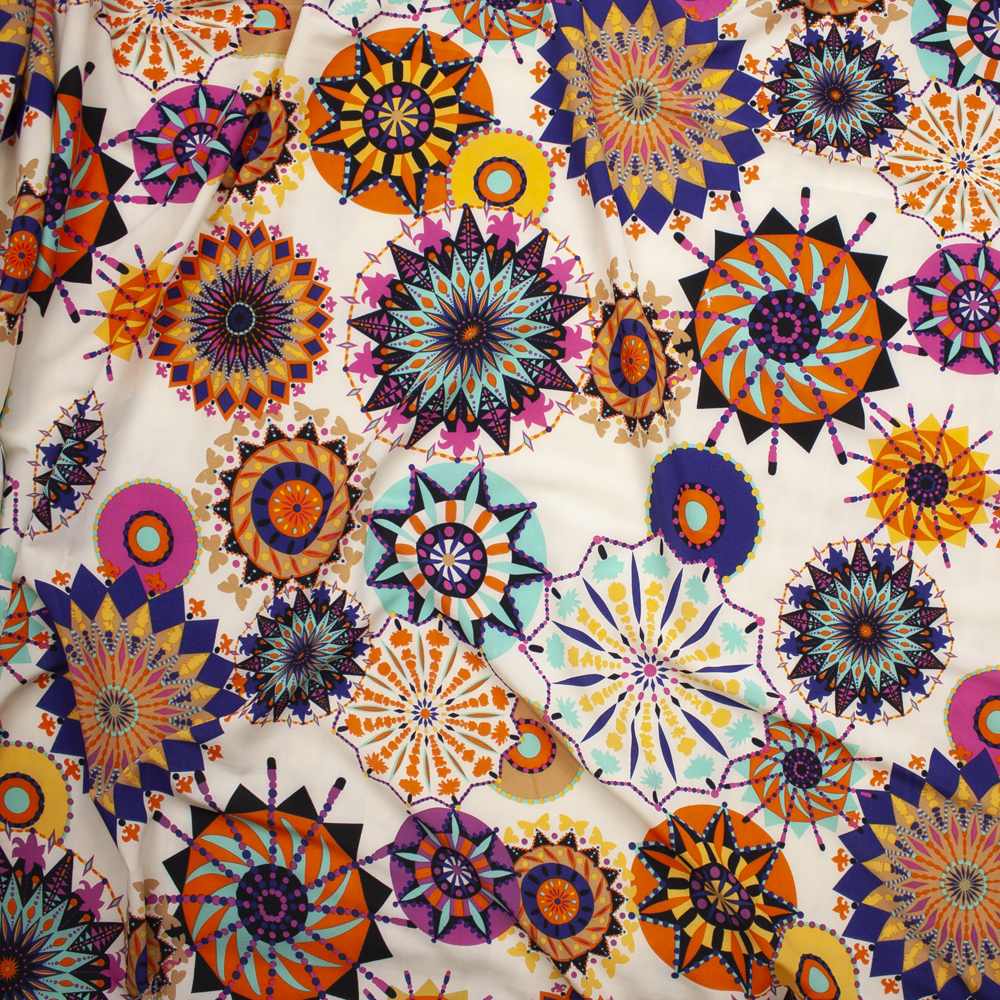 Bright Bursts on Ivory Poly Peachskin Fabric By The Yard - Wide shot