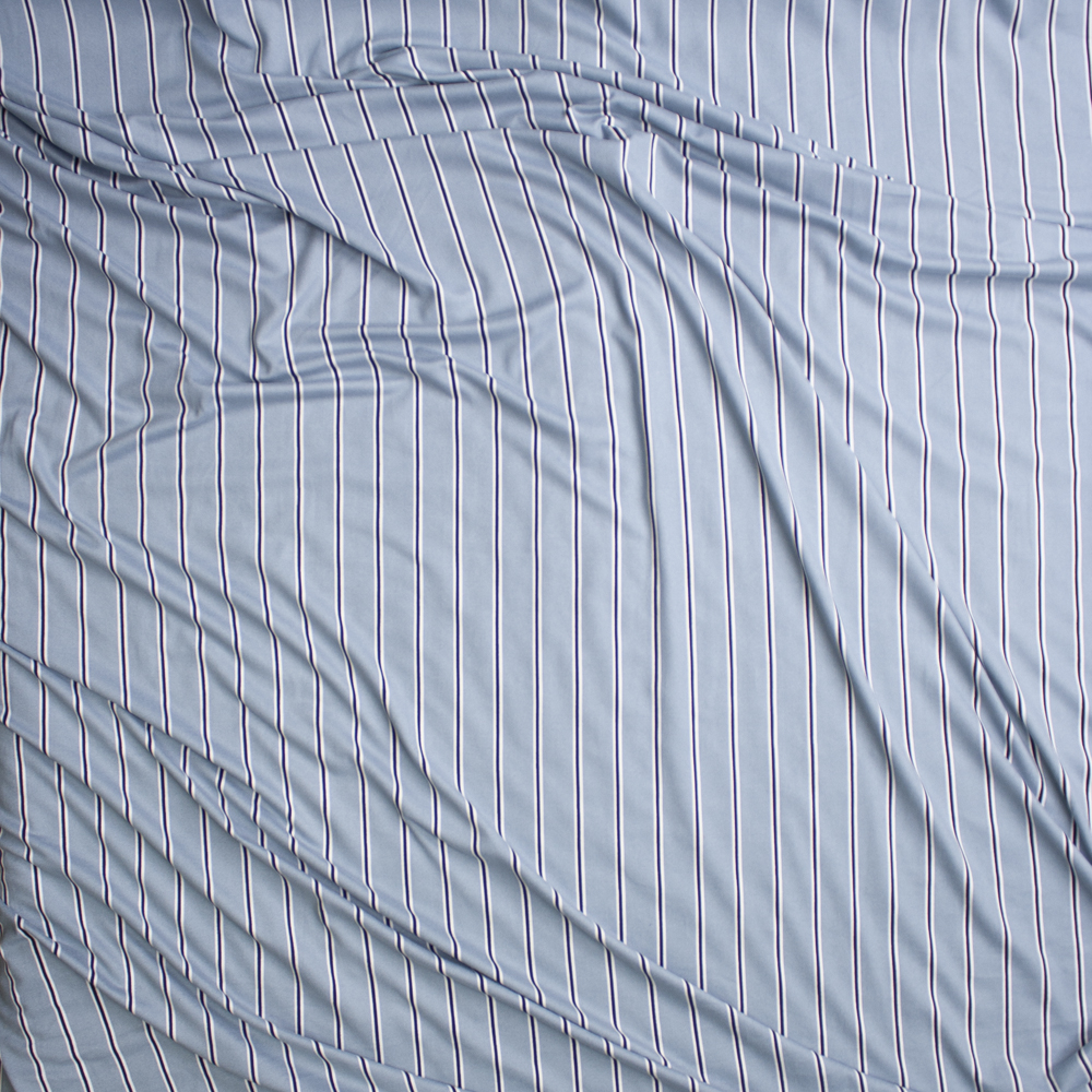 Black and White Narrow Vertical Stripes on Dusty Light Blue Double Brushed Poly Spandex Fabric By The Yard - Wide shot