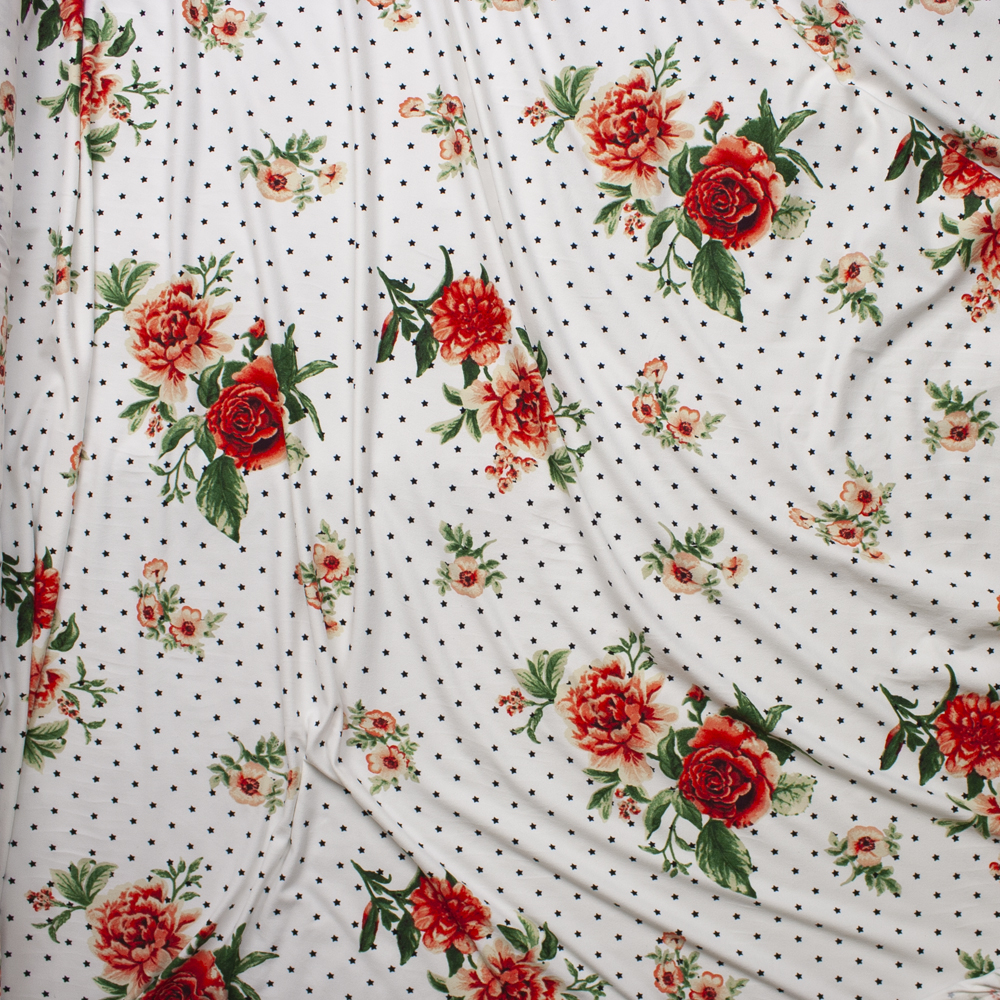 Red and Pink Rose Floral on a Background of Black Stars on White Double Brushed Poly Spandex Fabric By The Yard - Wide shot