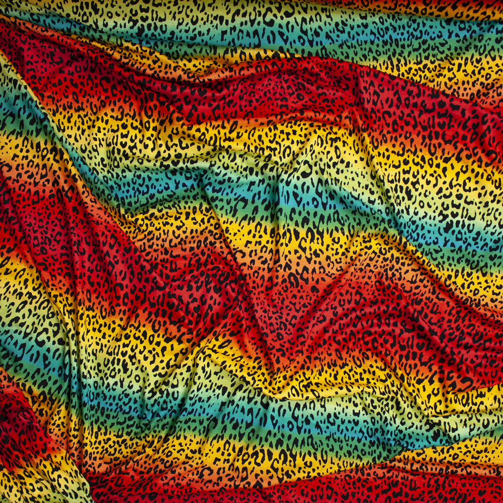 Cheetah Print on Red, Yellow, and Teal Ombre Rainbow Stretch Rayon Jersey Knit Fabric By The Yard - Wide shot