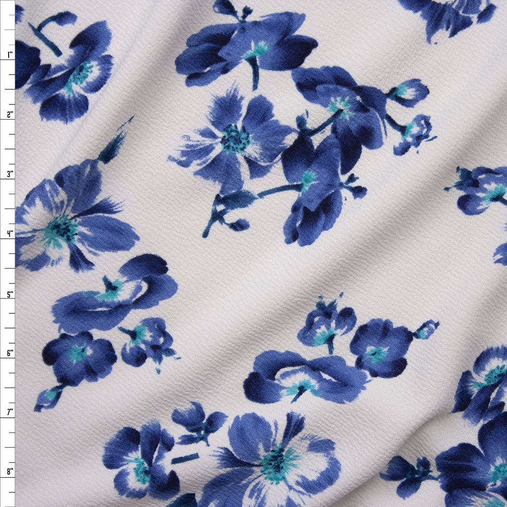 Blue, Black, and Turquoise Hibiscus Floral on White Crepe Textured Liverpool Knit Fabric By The Yard