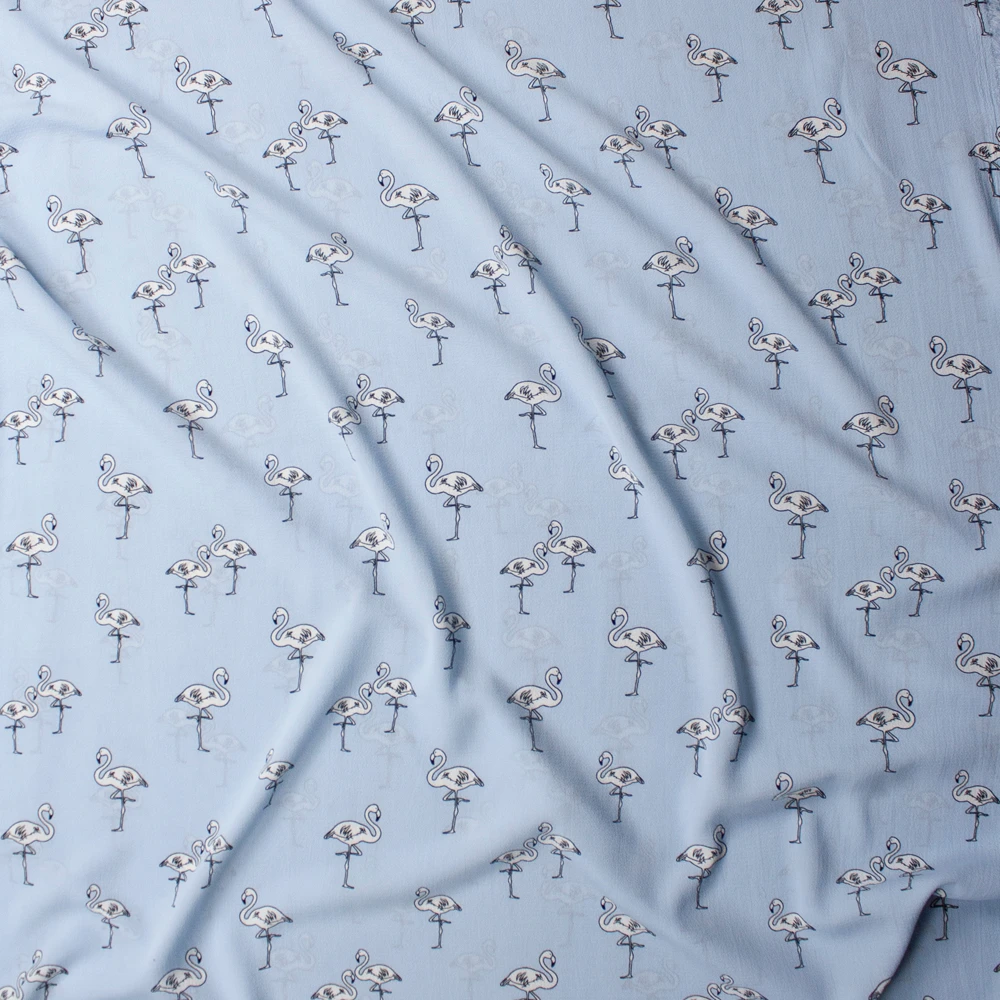 White Flamingos on Light Blue Bubble Crepe Fabric By The Yard - Wide shot