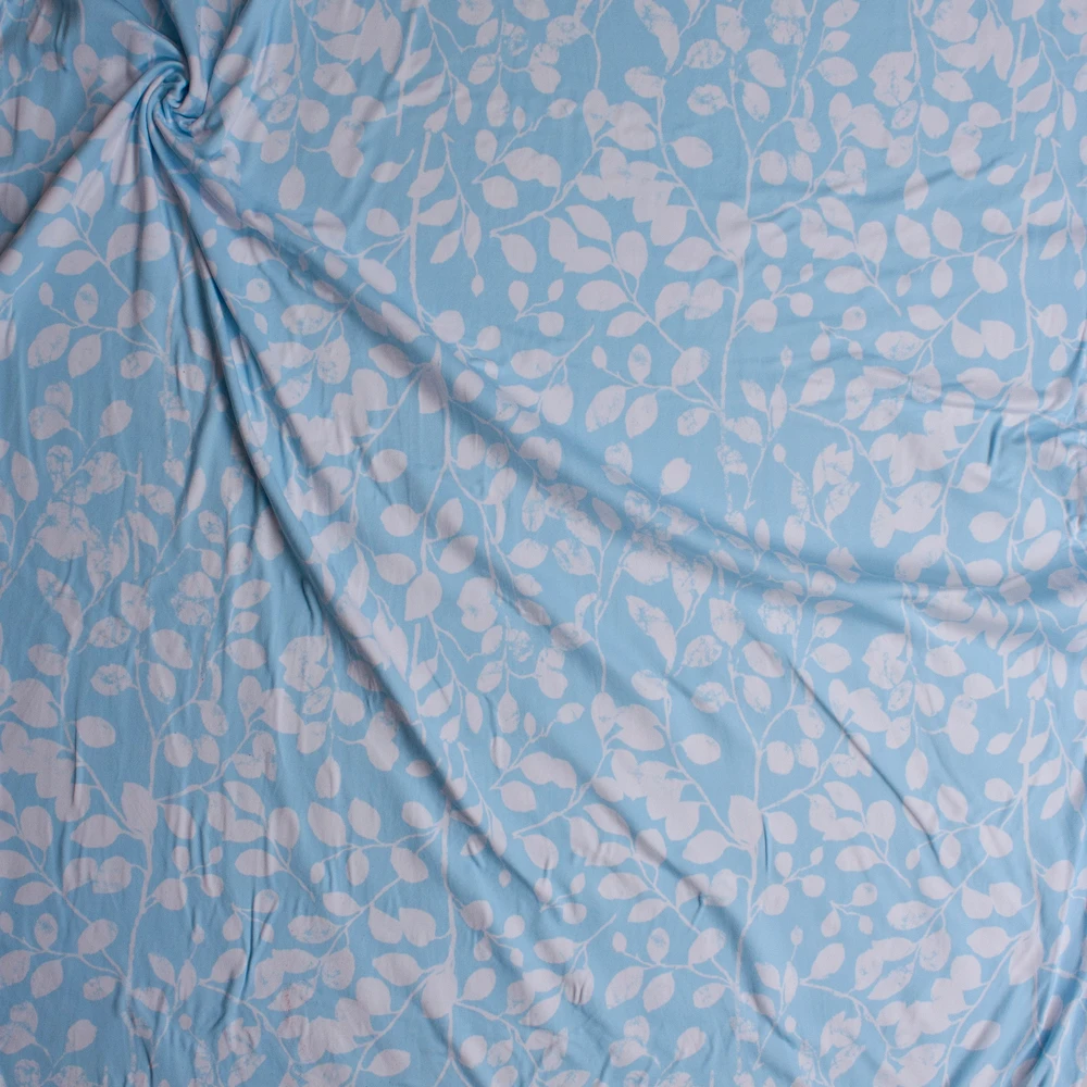 White Grunge Leaf Pattern on Sky Blue Double Brushed Poly/Spandex Knit Fabric By The Yard - Wide shot