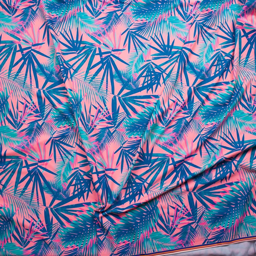 Mint, Teal, and Neon Pink Tropical Leaves on Pink Stretch Nylon/Lycra Knit Fabric By The Yard - Wide shot
