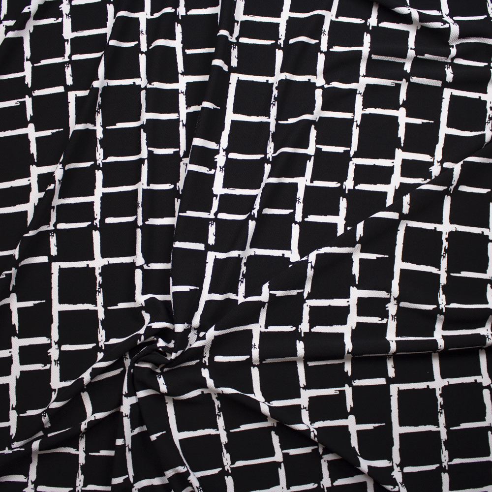 White Grunge Grid on Black Crepe Liverpool Knit Fabric By The Yard - Wide shot