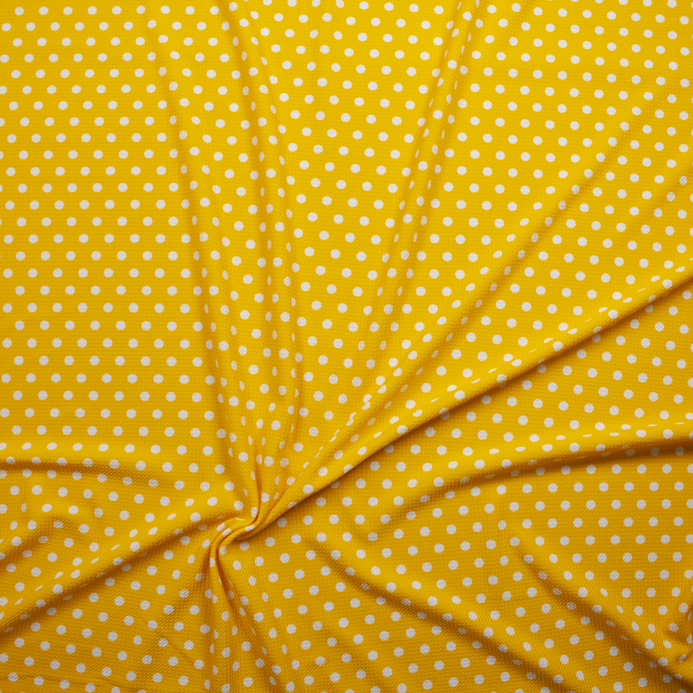 White on Bright Yellow Polka Dot Bullet Liverpool Knit Fabric By The Yard - Wide shot