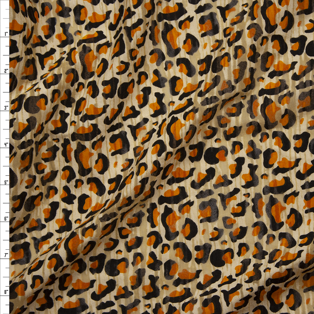 Tan, Caramel, and Black Cheetah Print Burnout Jersey Knit Fabric By The Yard