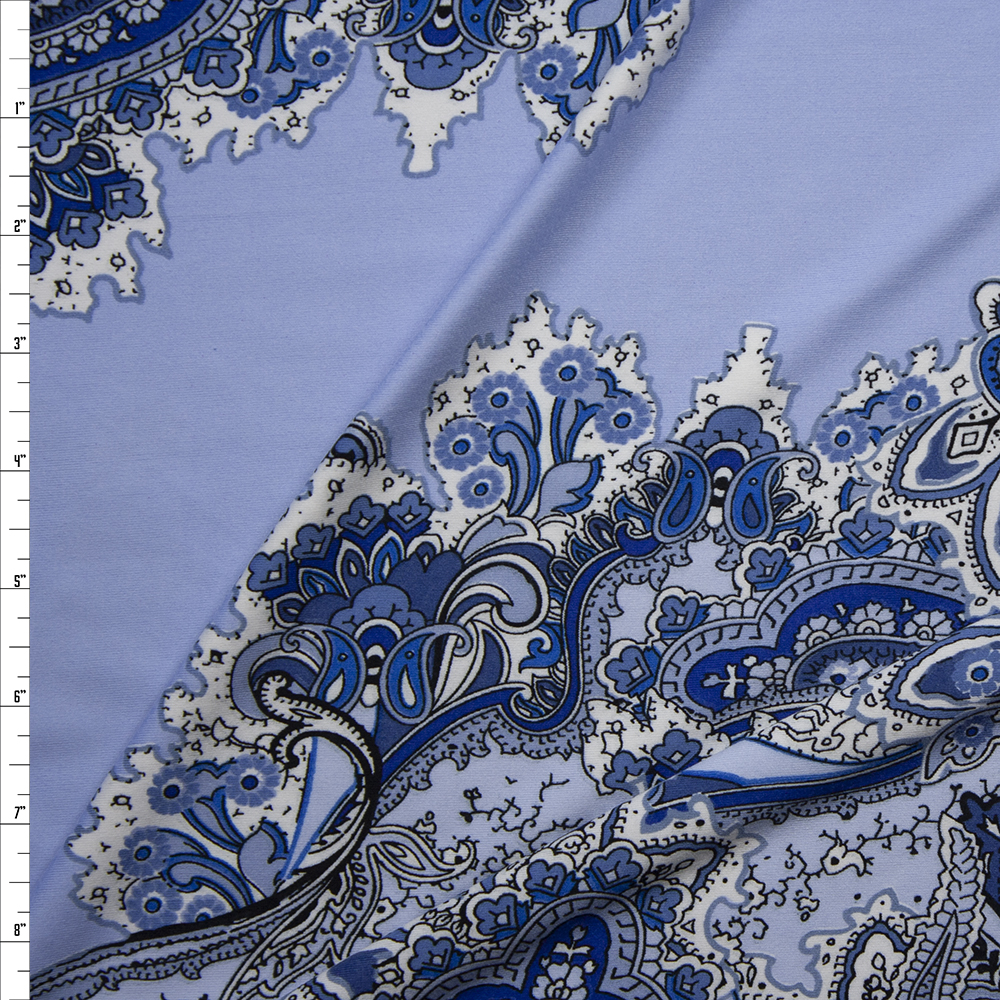 Blue and White Paisley Diagonal on Light Blue Poly/Spandex Knit Fabric By The Yard
