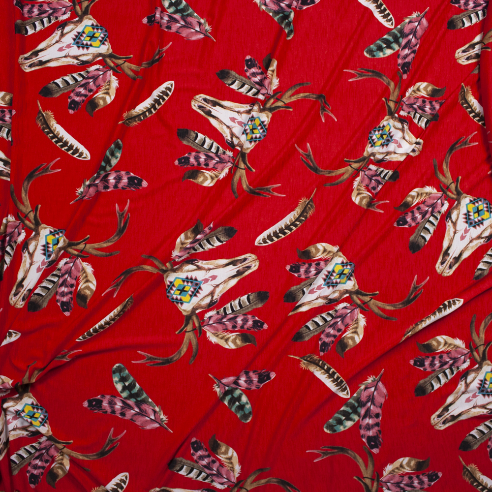 Deer Skulls on Bright Red Stretch Poly Knit Fabric By The Yard - Wide shot