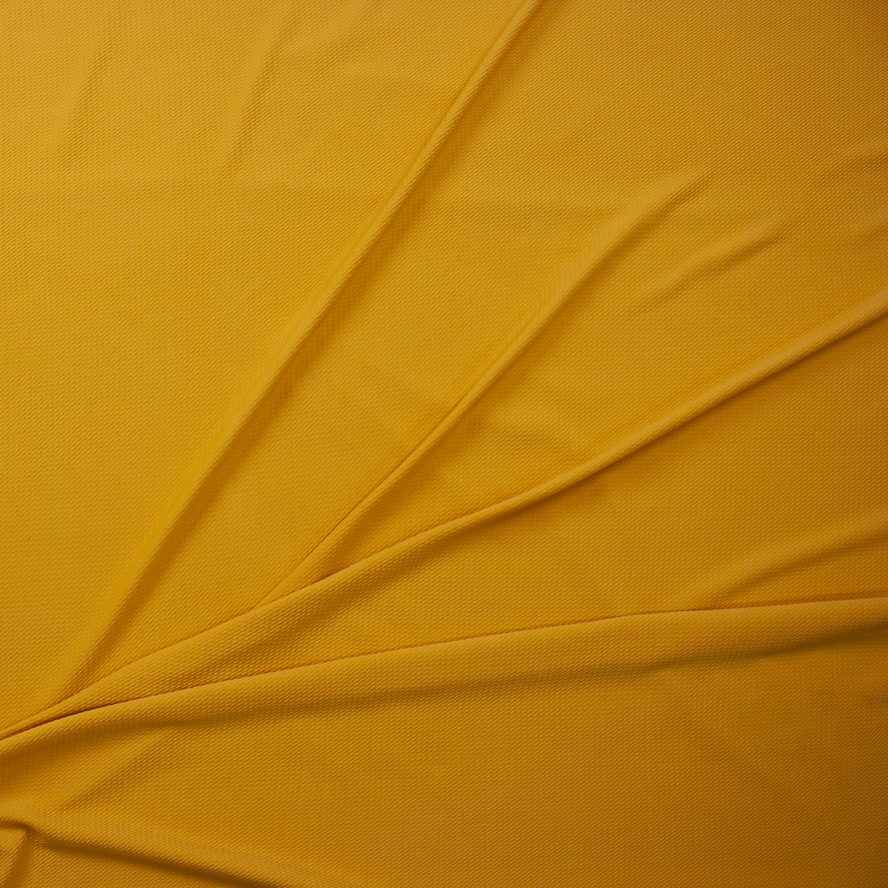 Goldenrod Solid Bullet Liverpool Knit Fabric By The Yard - Wide shot
