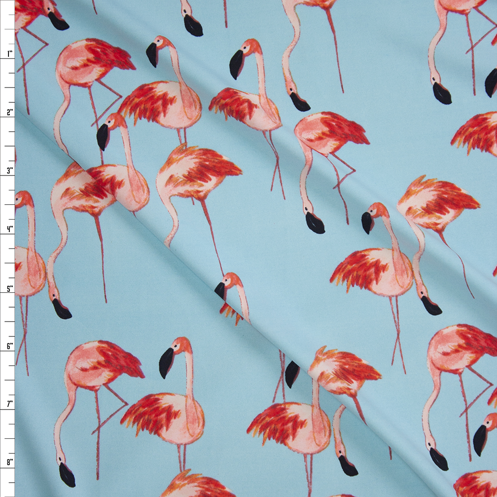 Pink Flamingos on Light Blue Nylon/Spandex from Manhattan Beachwear Fabric By The Yard