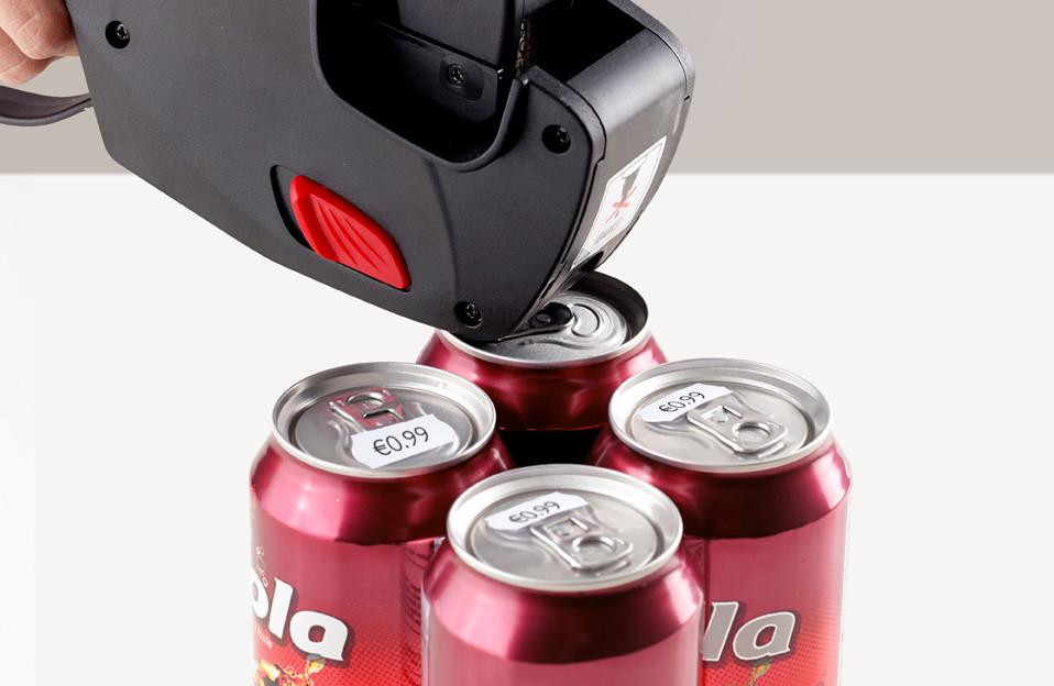 CW Office Avery Labels for Labelling Gun 1-Line Permanent White 12x26mm 1500 Per Roll (Pack 10) - PLP1226, labels being applied to soda cans with a labelling gun.