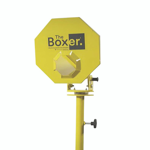 CW Office Desk Mounted Paper Void Fill Dispenser, yellow, mounted on a stand, used for packing and cushioning fragile items.