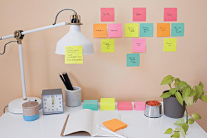 Post-it Post-It Super Sticky Notes 47.6x47.6mm 90 Sheets Cosmic Colours pack of 12, colorful sticky notes on a wall and desk for organization and reminders
