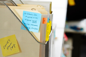 Post-it Note Cube 76x76mm 450 Sheets Pastel Blue 2028B - 7100172385, image showing a pastel blue sticky note on a file folder in an office setting
