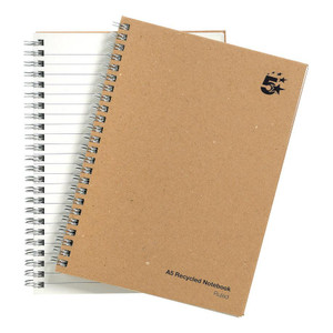 CW Office Wbnd Notebook Rld RCYC A5 Buf PK5, recycled spiral-bound notebooks in brown kraft covers with black printed text and logo, featuring ruled pages for writing.
