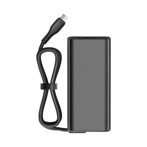 Various 65W USB-C AC Adapter with 8 output voltages for all USB-C devices up to 65W - UK Connections, black universal power adapter with detachable charging cable shown against a white background.