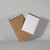 CW Office C5 H/comb Pad/Mailers P&S 80gsm WH PK100, white mailing pads and kraft mailers on a gray background.