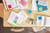 Post-it Notes 76x127mm 100 Sheets Energetic Colours pack, colorful sticky notes scattered on a desk, used for notes and organization in an office or study setting.