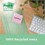 Post-it Super Sticky 100% Recycled Notes Assorted Colours 76 x 76 mm, a pack of 70 sheets per pad, with colorful sticky notes on a wooden desk alongside a keyboard and a potted plant.