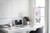 Post-it Post it Super Sticky Notes Soulful Colours 76x127mm 90 Sheets (Pack 6), colorful sticky notes on a white office desk and wall, ideal for organization and reminders.