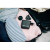 Various Verbatim (30239) Mini GaN Charger 100W With Display, compact black GaN fast charger with digital display placed inside a travel bag with clothing and accessories.