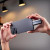 Various ADATA SC750 1TB USB-C Portable SSD, person holding the sleek black Titanium-colored external SSD showing its compact design and USB-C connector for fast data transfer.