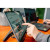 Various Verbatim (32402) Portable 15.6" Touch Monitor LIGHT, a person using the touch screen monitor at a workspace.