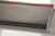 CW Office Black N Red Soft Cover Notebook A5, close-up of the black textured soft cover with red stitching detail.