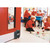 CW Office Fire Door Retainer Black 389332, a black door retainer device installed at the bottom of a fire door in a classroom setting.