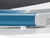 CW Office Dahle 502 A4 Personal Guillotine, close-up view of the blue and gray paper cutter's safety guard and cutting edge.